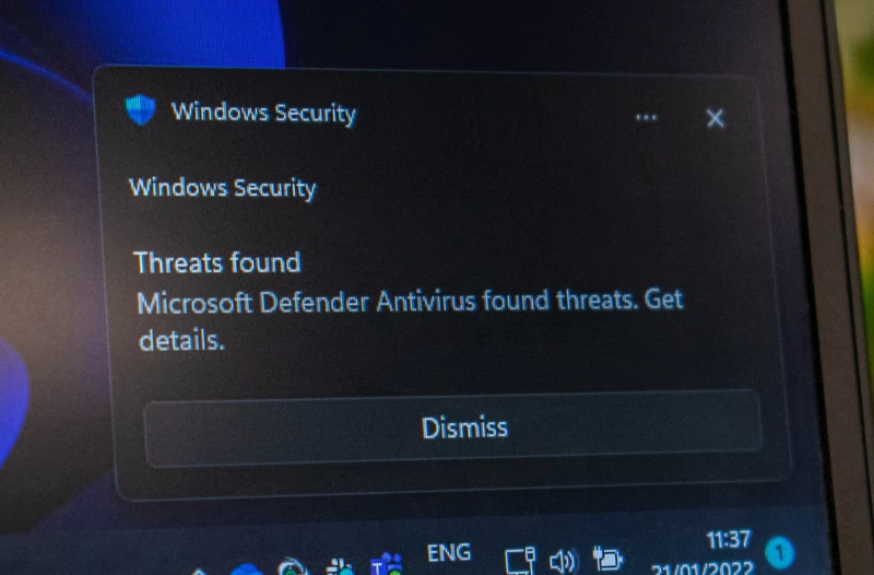 A Windows Security alert showing "Threats Found" by Microsoft Defender Antivirus.